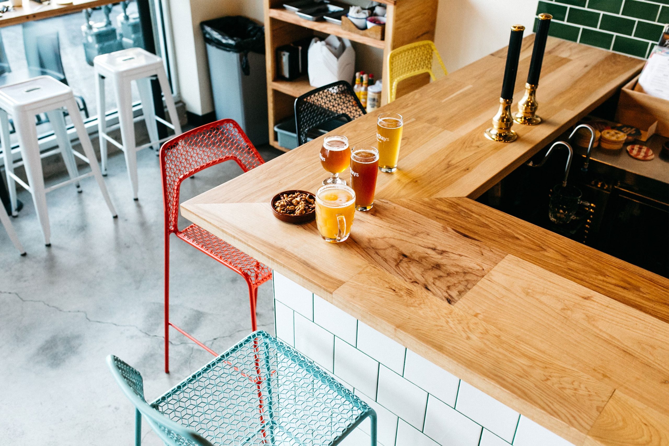 Away Days Brewing Co. Bar in the brewery with glass on